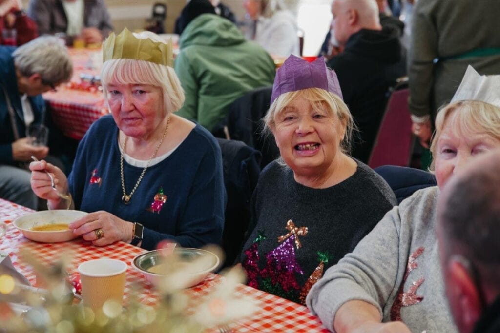 Guests enjoying a FoodCycle community meal during the winter season