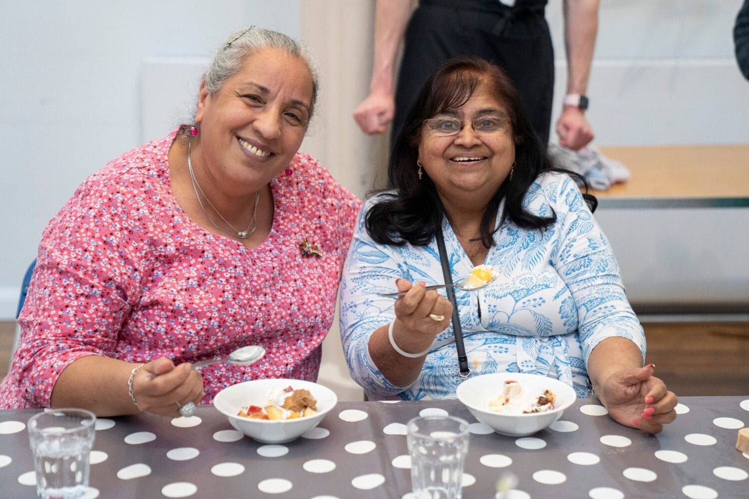 Guest smiling at FoodCycle community meal
