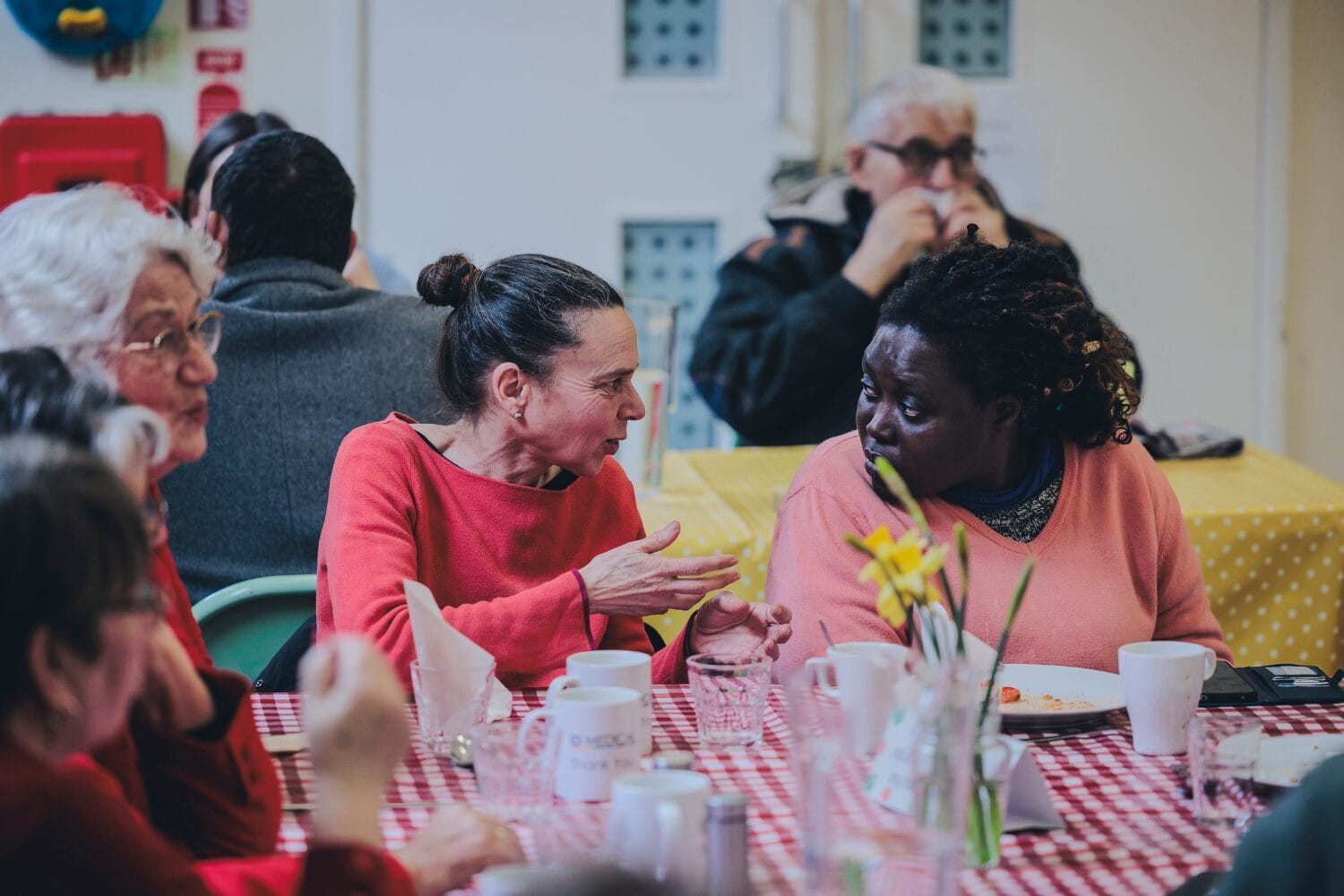 Guests chatting at FoodCycle community meal