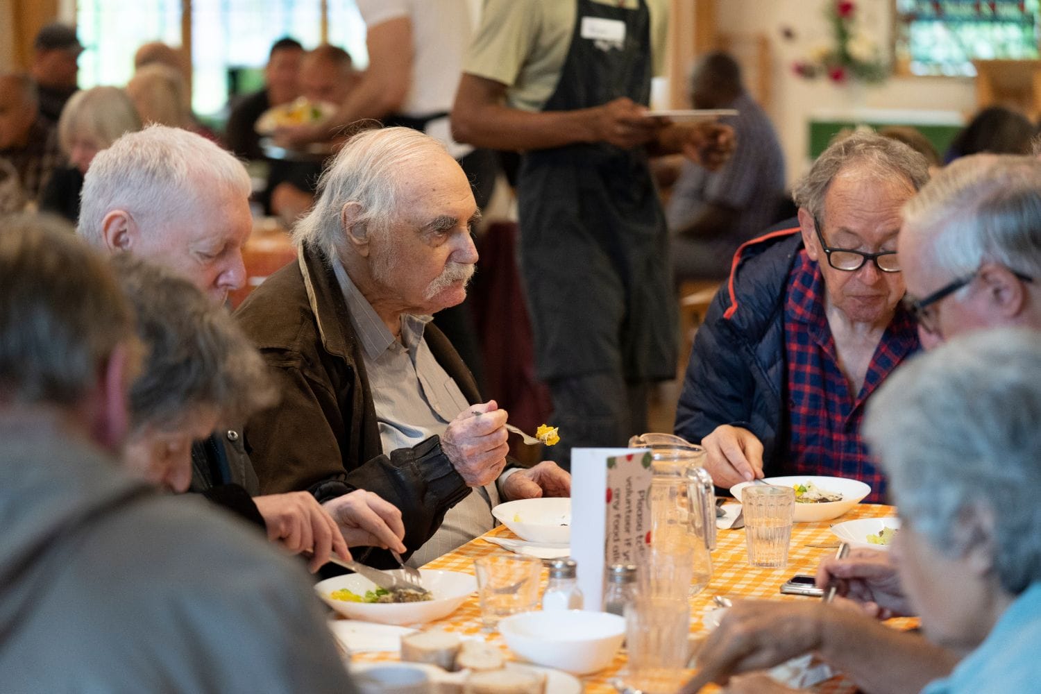 People eating FoodCycle Community Meal