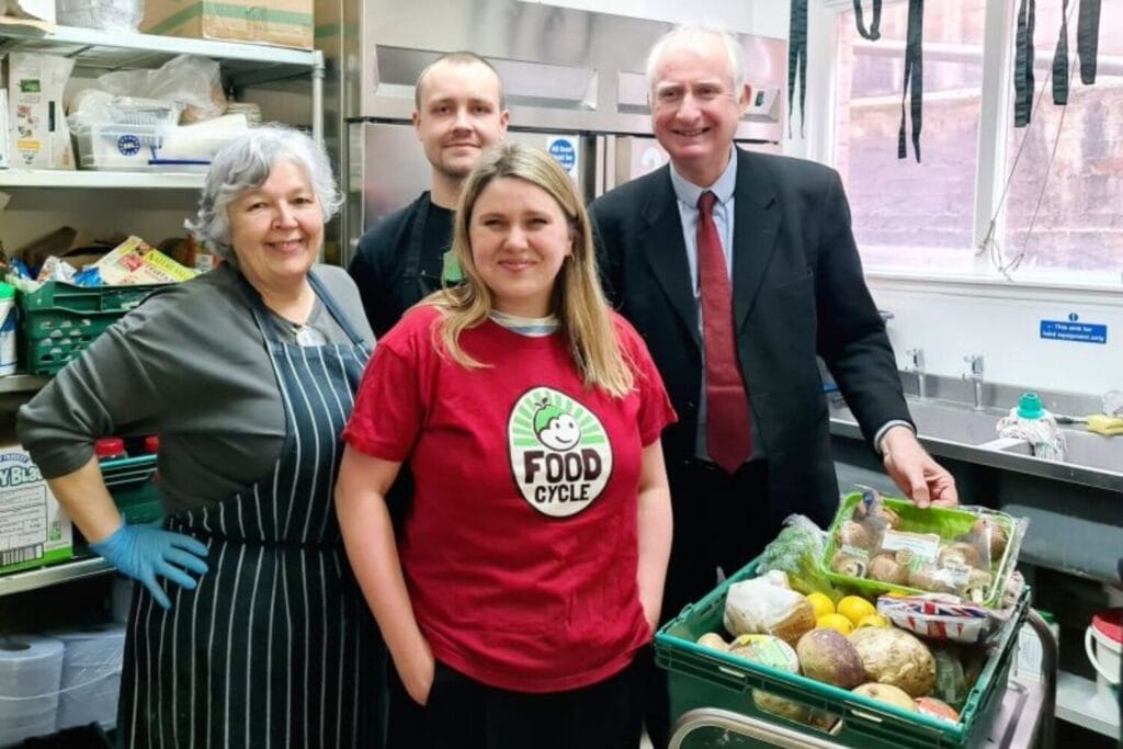 Minister for Food Security Daniel Zeichner visiting a FoodCycle community meal in Cambridge, engaging with volunteers and guests.