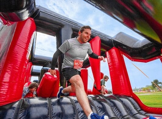 Person competing in inflatable fun run