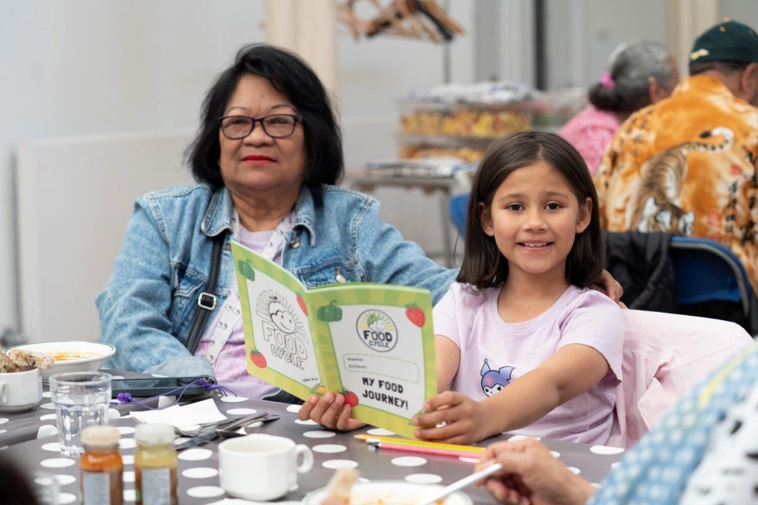 Child and guardian at FoodCycle community meal